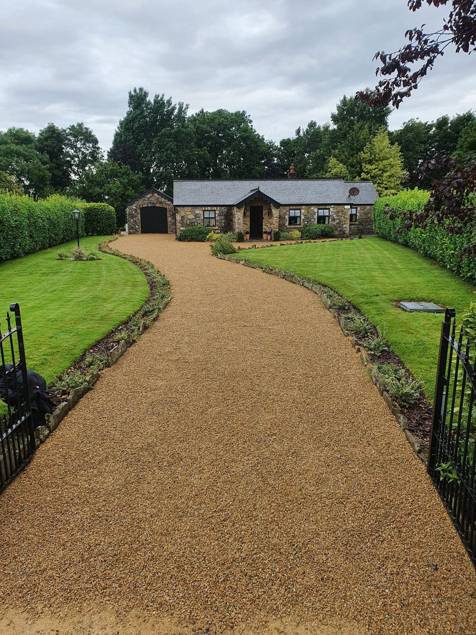 Restored golden gravel driveway at a stone country house in Co. Dublin