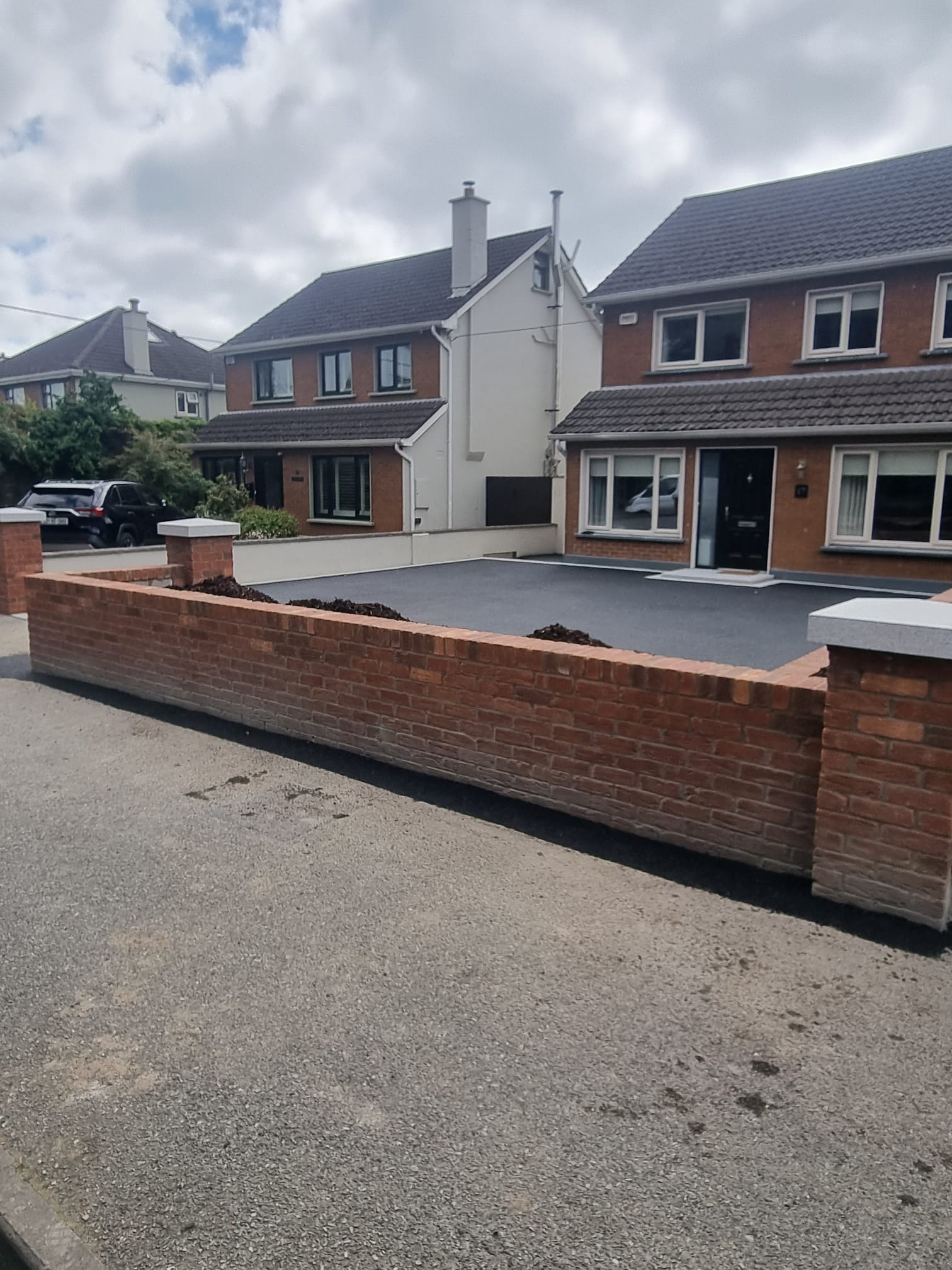 Tarmac Forecourt with Brick Boundary Wall