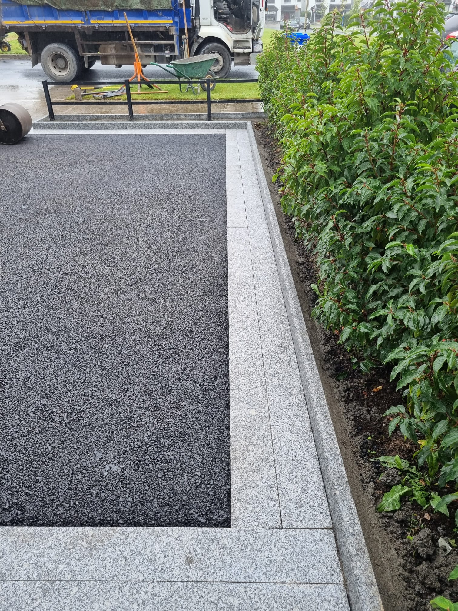 Tarmac panel with granite border at a commercial site