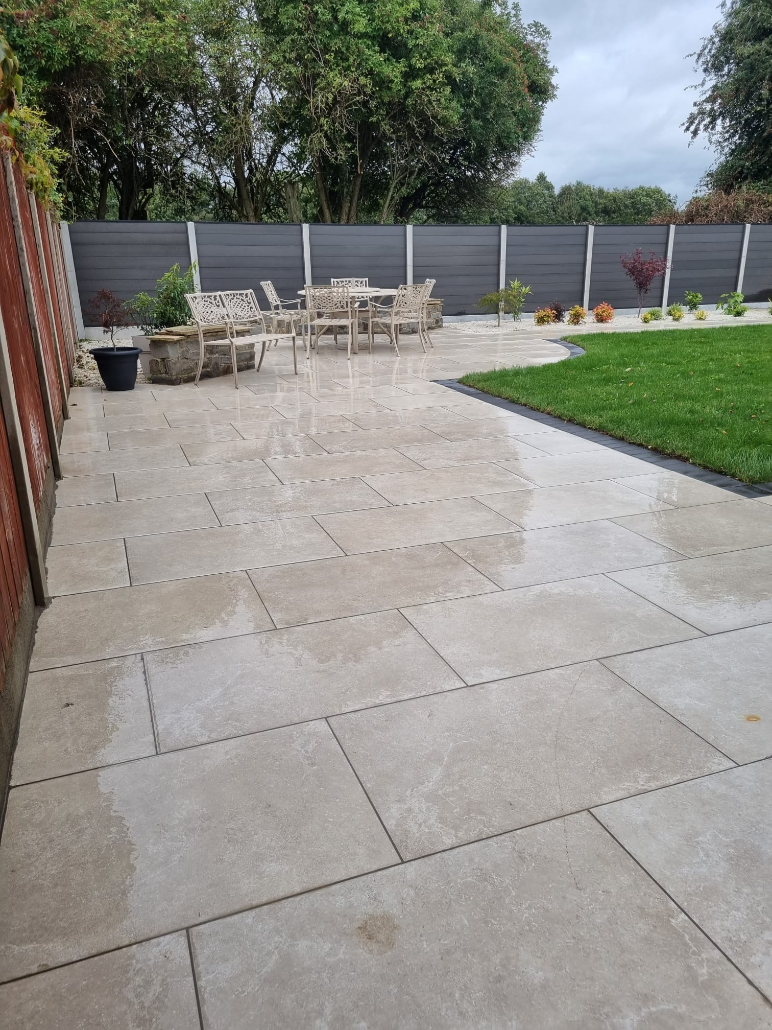 Cream porcelain patio with cast iron garden furniture