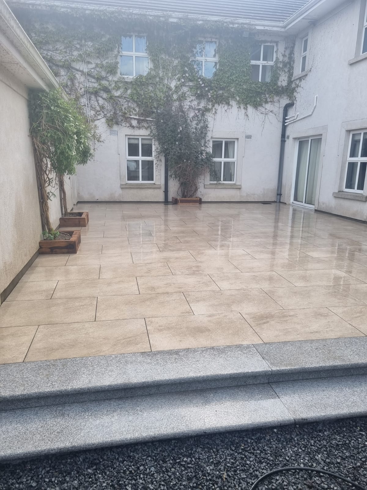 Cream porcelain patio at a period stone house