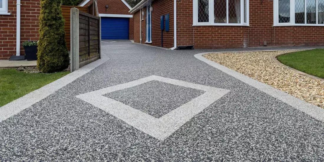 Grey resin bound driveway with decorative diamond inlay feature, a recent Delaney Tarmac install in Dublin