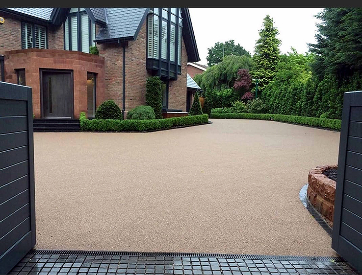 Warm-tone resin bound driveway in front of a Dublin home