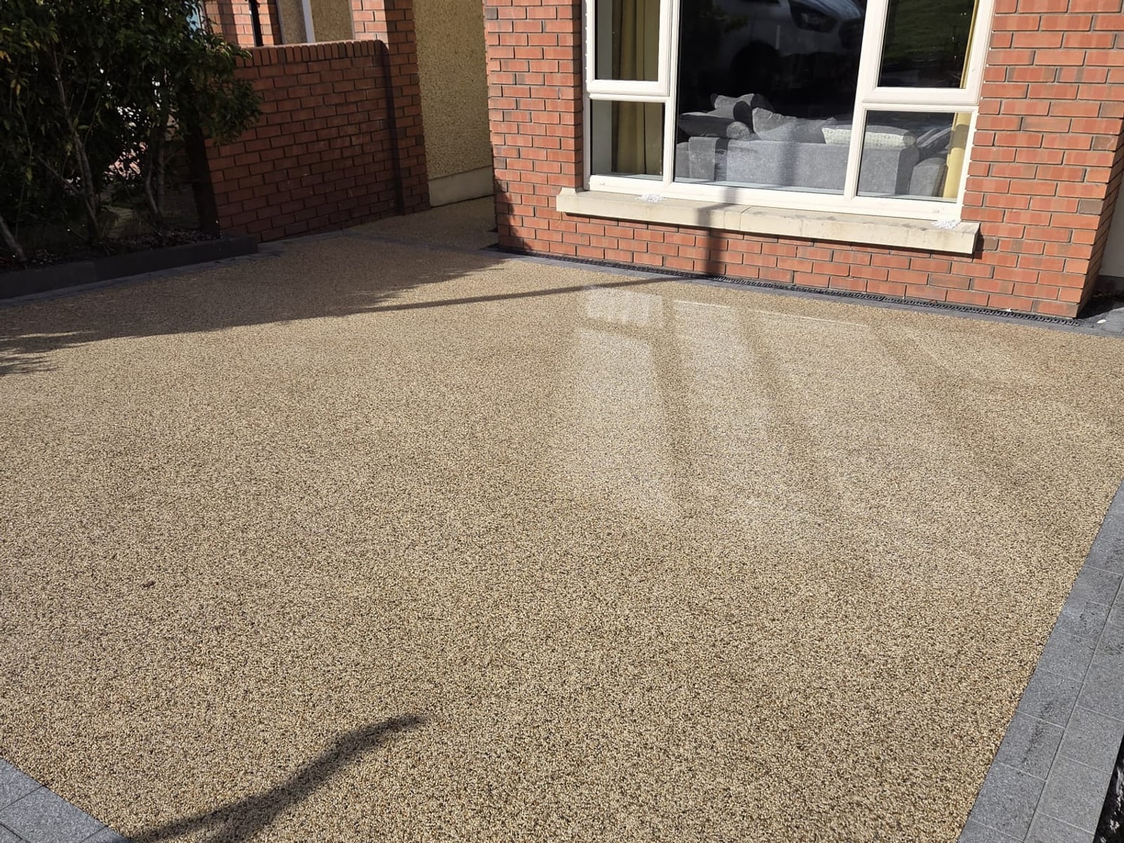 Resin-bound driveway with a double granite border, laid by Delaney Tarmac